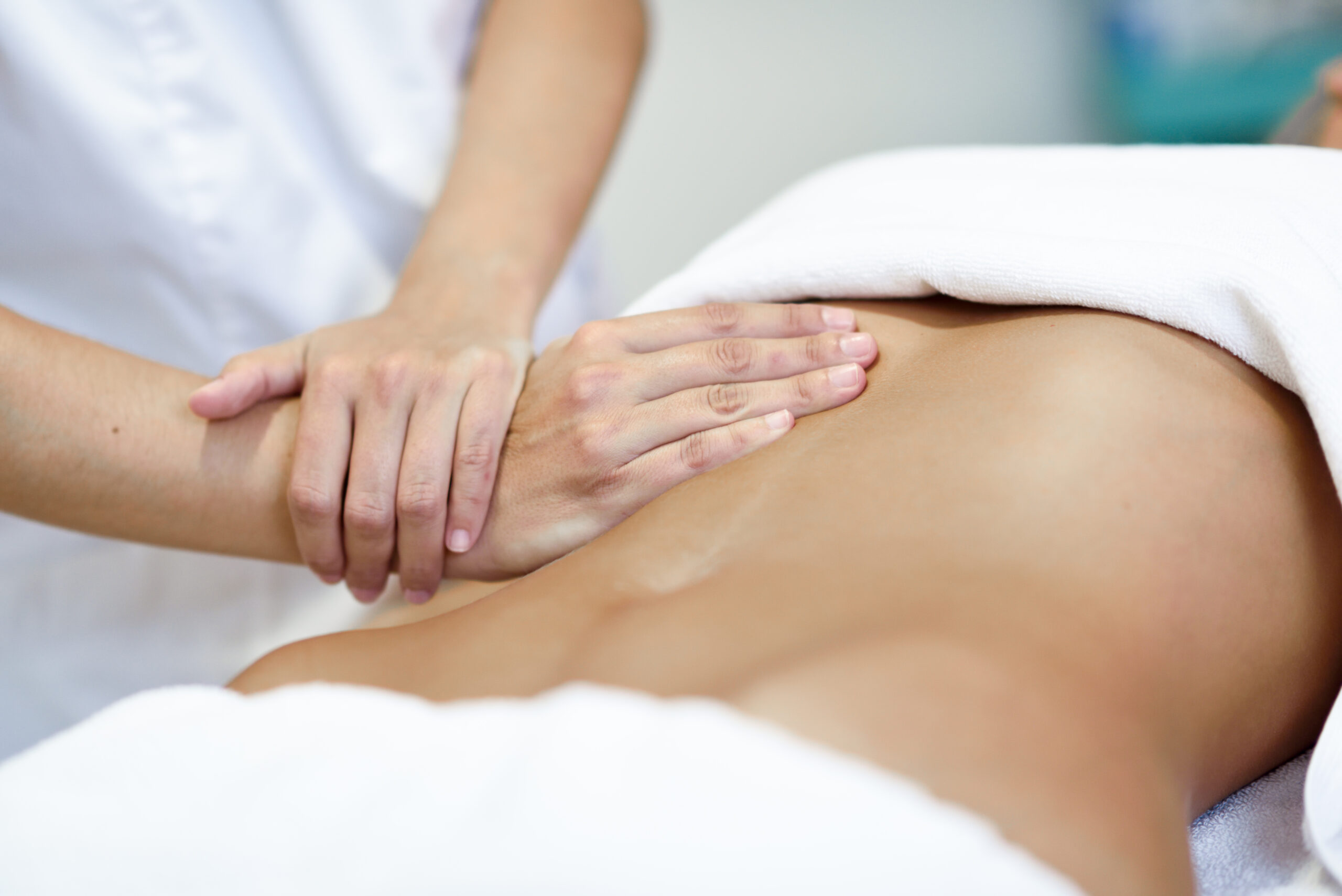 Hands massaging female abdomen.Therapist applying pressure on be